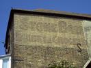 [Advertisement painted on a house in Lower Upnor]