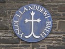 [Circular blue sign reading 'Ysgol Llanddewi-Brefi']