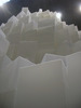 [Boxes towering above, eclipsing the light]